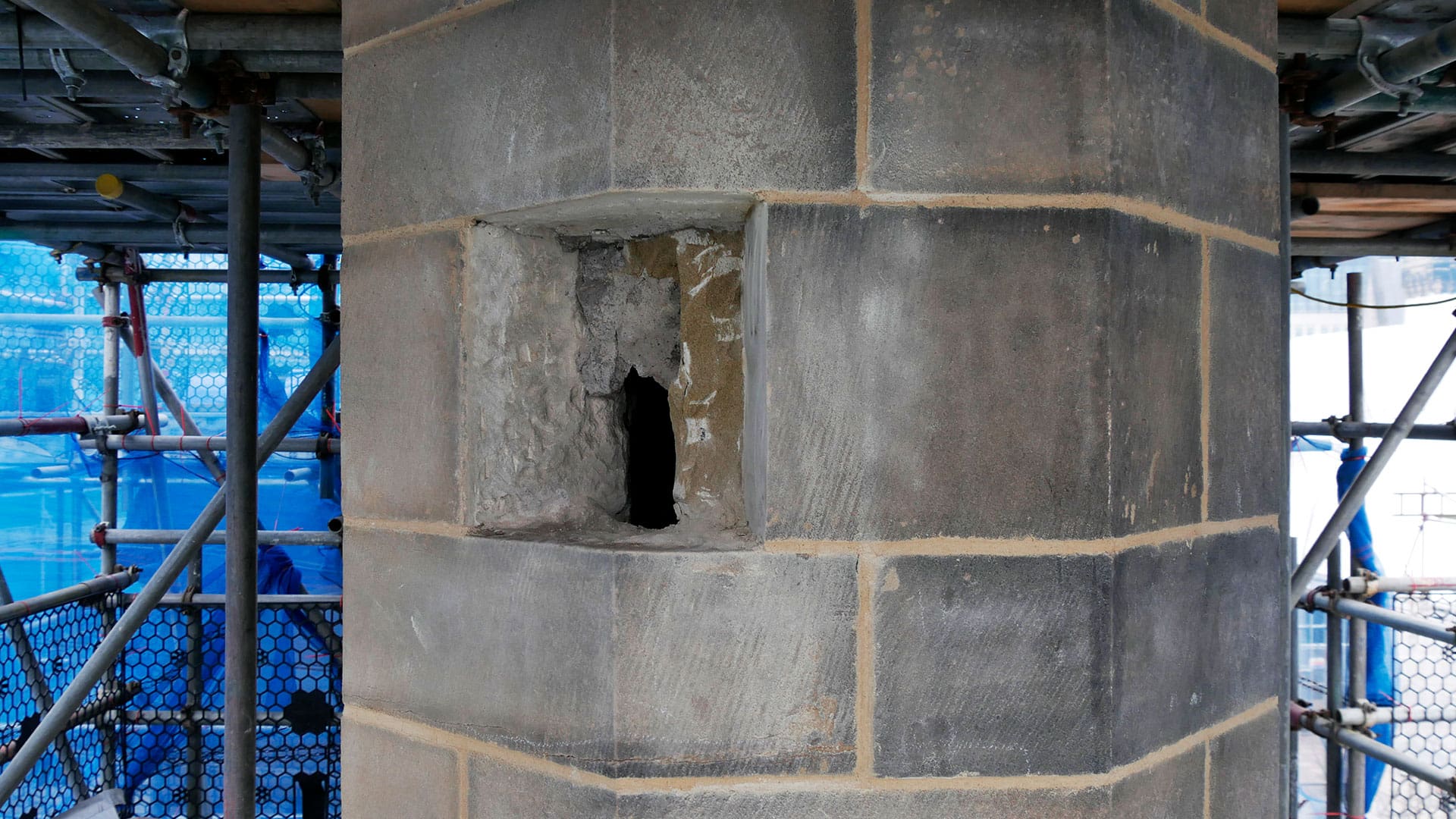 Lyons Stonework stonemasons performing precision stone indents to restore damaged stone features.