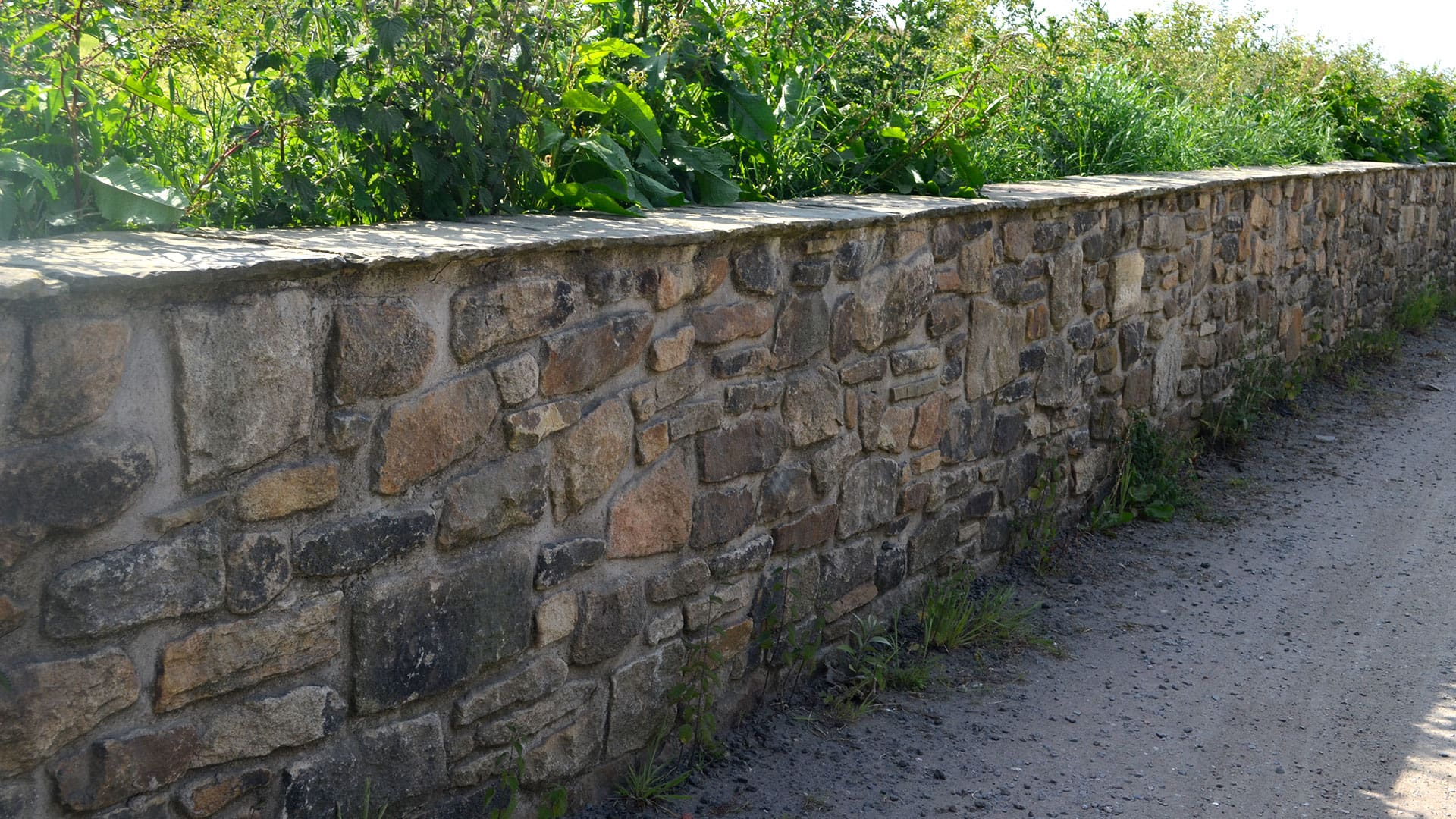 Lyons Stonework’s expert wallers constructing durable and elegant stone walls for a range of projects.