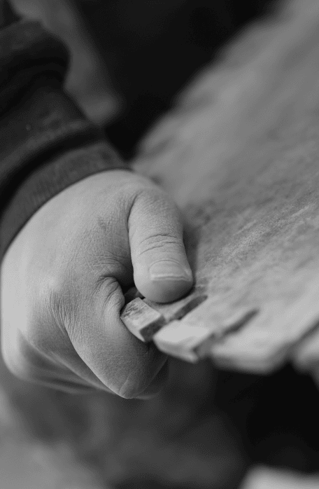 Master craftsman at Lyons Stonework expertly carving and restoring stone features with precision and artistry.