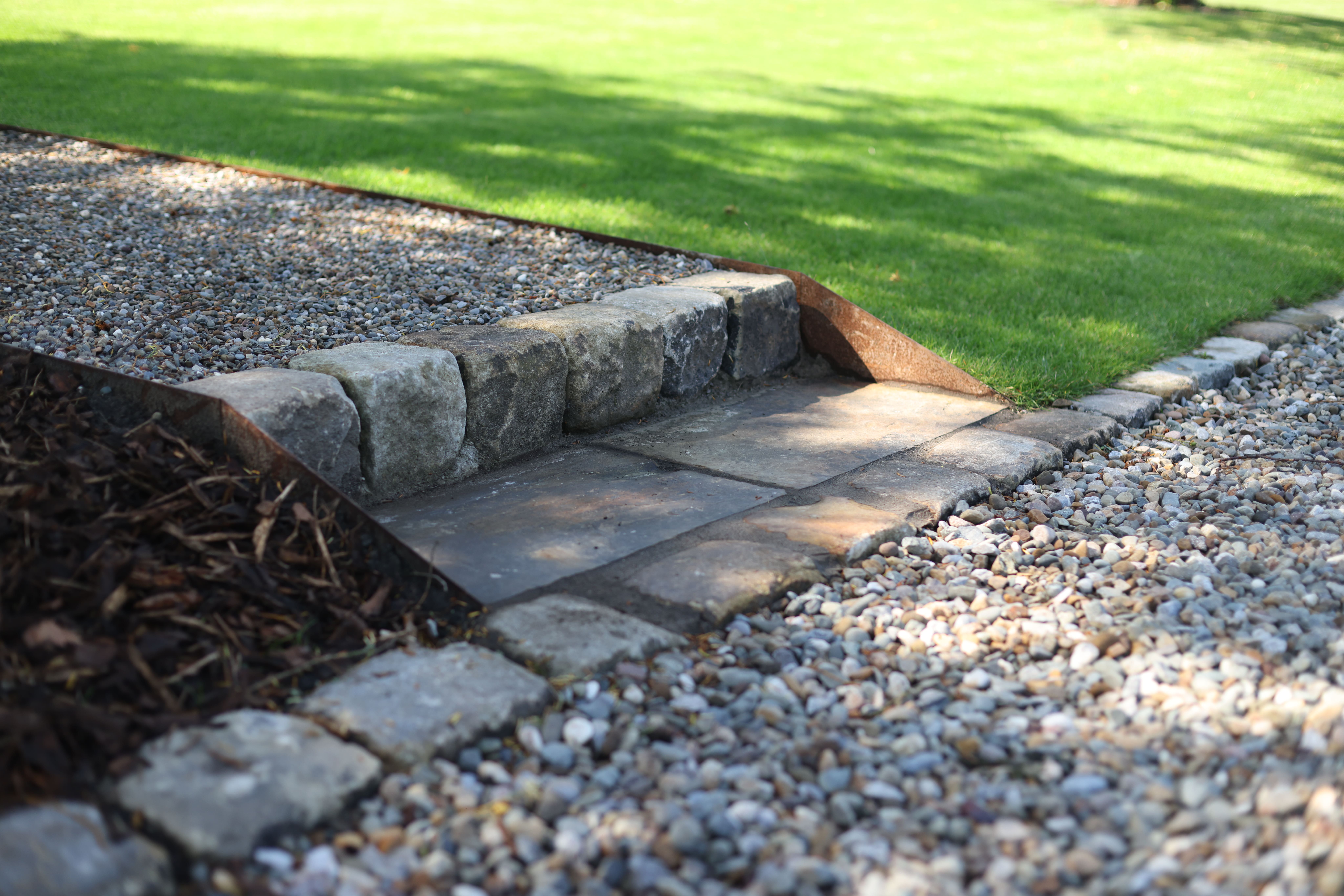 Lyons Stonework manufacturing and installing custom stone sets and cobbles, providing durable and aesthetic paving solutions.