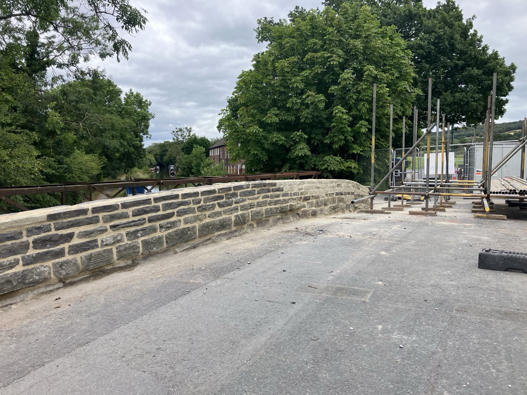 Lyons Stonework carrying out detailed stone bridge repairs, restoring structural integrity and maintaining aesthetic appeal.