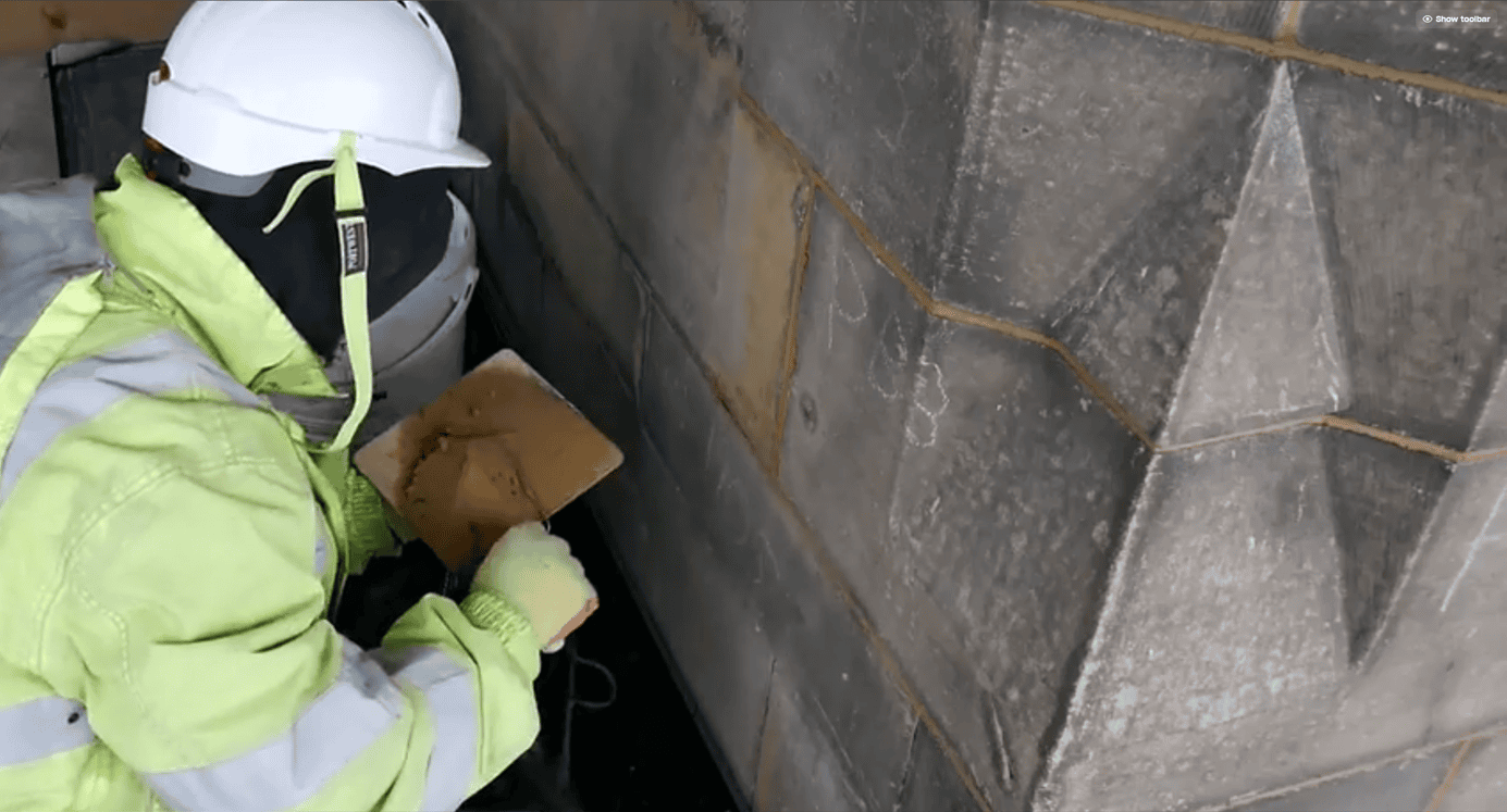 Lyons Stonework applying lime mortar pointing to restore the joints in heritage stone structures.